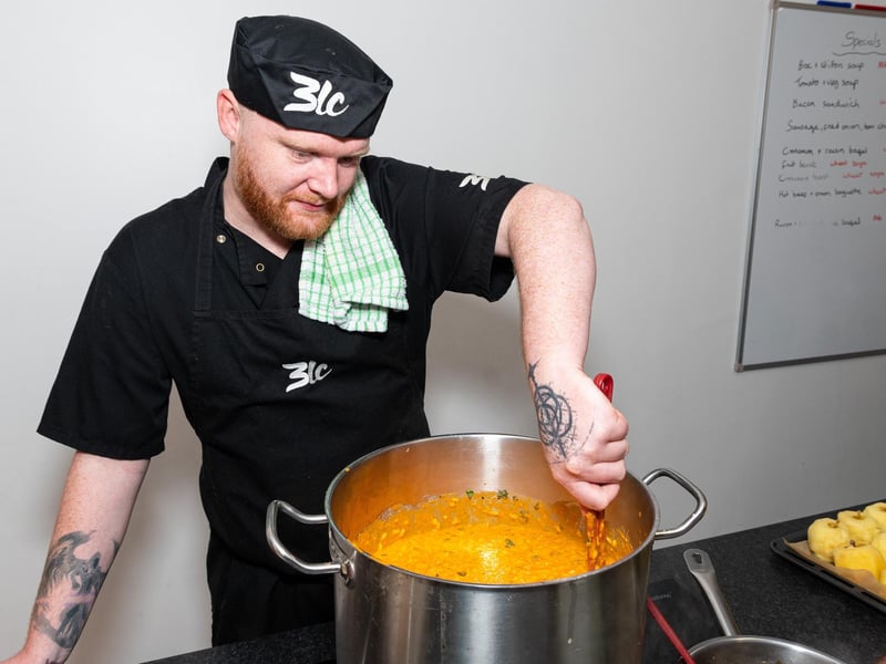 Chef Tim Buttersworth prepares food for the Waste Not Feast More event at Down At Town in Burnley Town Centre. Photo: Kelvin Lister-Stuttard