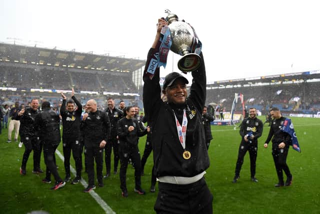 BURNLEY, ENGLAND - MAY 08: Vincent Kompany, Manager of Burnley celebrates with the Sky Bet Championship trophy celebrating promotion to the Premier League after defeating Cardiff City during the Sky Bet Championship between Burnley and Cardiff City at Turf Moor on May 08, 2023 in Burnley, England. (Photo by Gareth Copley/Getty Images)