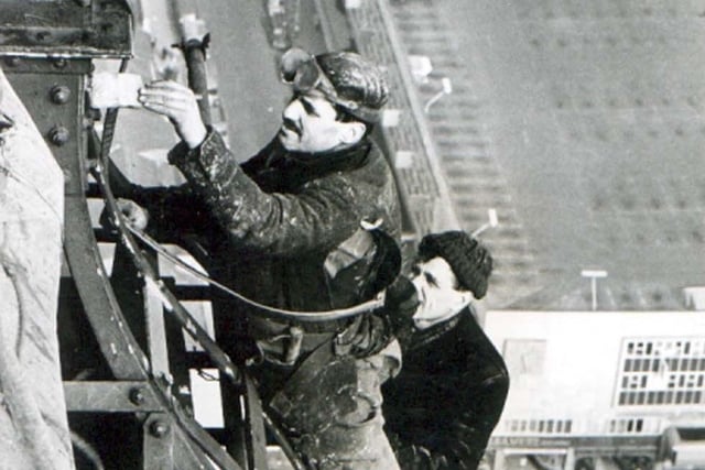 Another lick of paint should do it. These workmen are almost as close as you can get to the flagpole on Blackpool Tower. They are strapped on. This was in the 1960s