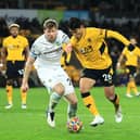 WOLVERHAMPTON, ENGLAND - DECEMBER 01: Hwang Hee-chan of Wolverhampton Wanderers is closed down by Nathan Collins of Burnley during the Premier League match between Wolverhampton Wanderers and Burnley at Molineux on December 01, 2021 in Wolverhampton, England. (Photo by David Rogers/Getty Images)