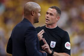 WATFORD, ENGLAND - AUGUST 12: Vincent Kompany, Manager of Burnley, is spoken to by the Fourth Official Leigh Doughty during the Sky Bet Championship between Watford and Burnley at Vicarage Road on August 12, 2022 in Watford, England. (Photo by Richard Heathcote/Getty Images)