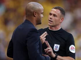 WATFORD, ENGLAND - AUGUST 12: Vincent Kompany, Manager of Burnley, is spoken to by the Fourth Official Leigh Doughty during the Sky Bet Championship between Watford and Burnley at Vicarage Road on August 12, 2022 in Watford, England. (Photo by Richard Heathcote/Getty Images)