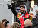 Jordan North celebrates the end of his 100 mile rowing challenge with a pint of Guinness. Photo: Kelvin Stuttard