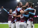 BURNLEY, ENGLAND - DECEMBER 17: Manuel Benson of Burnley celebrates with teammates after scoring their side's second goal during the Sky Bet Championship between Burnley and Middlesbrough at Turf Moor on December 17, 2022 in Burnley, England. (Photo by Cameron Smith/Getty Images)