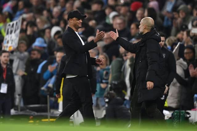 MANCHESTER, ENGLAND - MARCH 18: Pep Guardiola, Manager of Manchester City, shakes hands with Vincent Kompany, Manager of Burnley, after the team's victory in the Emirates FA Cup Quarter Final match between Manchester City and Burnley at Etihad Stadium on March 18, 2023 in Manchester, England. (Photo by Michael Regan/Getty Images)