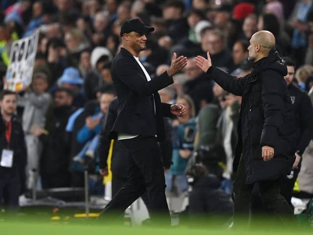 MANCHESTER, ENGLAND - MARCH 18: Pep Guardiola, Manager of Manchester City, shakes hands with Vincent Kompany, Manager of Burnley, after the team's victory in the Emirates FA Cup Quarter Final match between Manchester City and Burnley at Etihad Stadium on March 18, 2023 in Manchester, England. (Photo by Michael Regan/Getty Images)