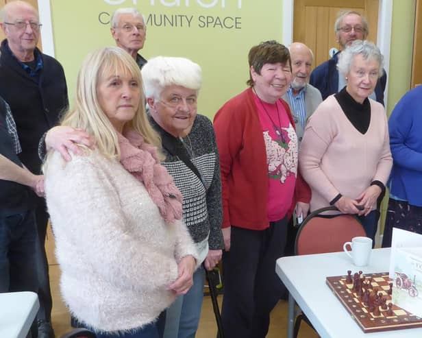 The Monday at One group celebrate with a birthday cake containing ten candles – one for each ten of Terry’s 100 years.