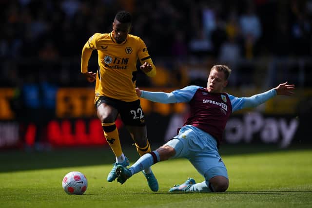 BURNLEY, ENGLAND - APRIL 24: Matej Vydra of Burnley challenges Nelson Semedo of Wolverhampton Wanderers during the Premier League match between Burnley and Wolverhampton Wanderers at Turf Moor on April 24, 2022 in Burnley, England. (Photo by Stu Forster/Getty Images)