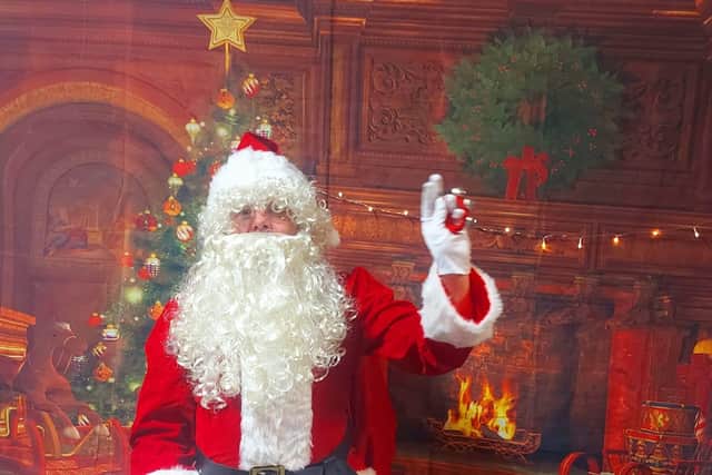 Nick Barrett, Holly Grove's family support manager, in his secondary role as Father Christmas