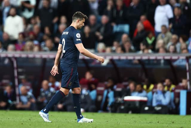 BIRMINGHAM, ENGLAND - MAY 19: Matthew Lowton of Burnley leaves the pitch after being shown a red card during the Premier League match between Aston Villa and Burnley at Villa Park on May 19, 2022 in Birmingham, England. (Photo by Naomi Baker/Getty Images)
