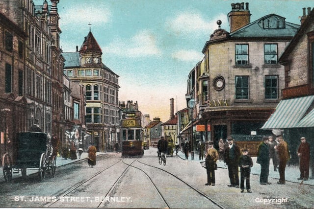 St James Street, in Burnley. The building with the clock tower, left, is St James’ Hall which was once a branch of Burton’s but later it became the Lefton’s furniture showroom. On the other side of the road, to the right, is Blue Clock Chambers, at one time Mercantile Chambers, with its branch of the Lancashire & Yorkshire Bank. The Tram is heading towards Curzon Street and Hammerton Street. Notice the single track.