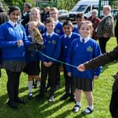 Pupils at Springfield Primary School hold an owl at the opening of the new forest school at Springfield Primary School, Burnley