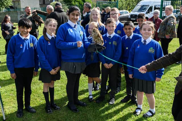 Pupils at Springfield Primary School hold an owl at the opening of the new forest school at Springfield Primary School, Burnley