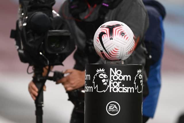The match ball is filmed pitch-side ahead of the English Premier League football match between Burnley and Tottenham Hotspur at Turf Moor in Burnley, north west England on October 26, 2020. (Photo by Michael Regan / POOL / AFP) / RESTRICTED TO EDITORIAL USE. No use with unauthorized audio, video, data, fixture lists, club/league logos or 'live' services. Online in-match use limited to 120 images. An additional 40 images may be used in extra time. No video emulation. Social media in-match use limited to 120 images. An additional 40 images may be used in extra time. No use in betting publications, games or single club/league/player publications. /  (Photo by MICHAEL REGAN/POOL/AFP via Getty Images)