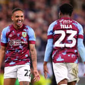 BURNLEY, ENGLAND - AUGUST 30: Vitinho of Burnley celebrates with teammate Nathan Tella after scoring their team's first goal during the Sky Bet Championship between Burnley and Millwall at Turf Moor on August 30, 2022 in Burnley, England. (Photo by Alex Livesey/Getty Images)