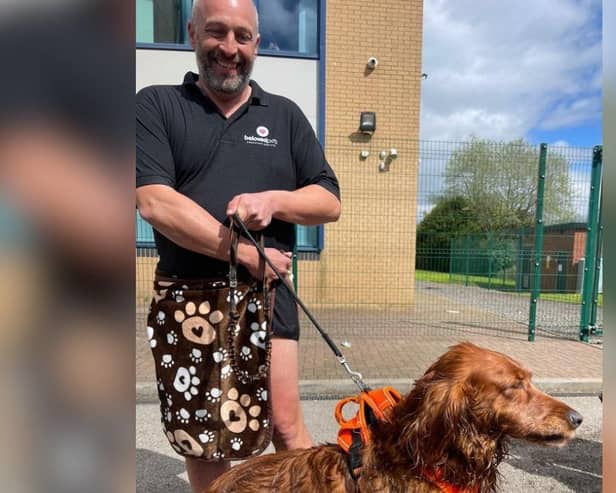 Mark Slater of Burnley-based Beloved Pets with Bertie the red setter following his rescue from the Leeds Liverpool Canal