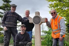 Ian Whalley, Neil Whalley (front), Shane Johnstone and Ivor Emo with the Butter Cross near the site of the former Bull and Butcher pub in Habergham Eaves