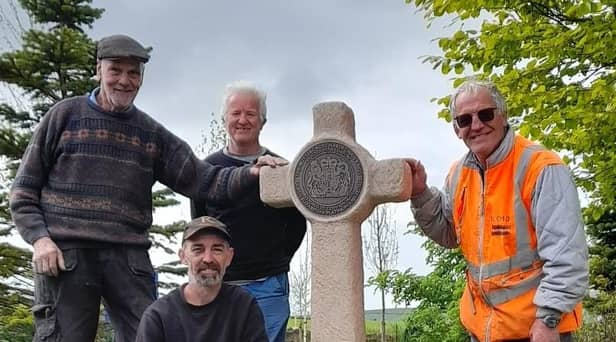 Ian Whalley, Neil Whalley (front), Shane Johnstone and Ivor Emo with the Butter Cross near the site of the former Bull and Butcher pub in Habergham Eaves