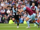 BURNLEY, ENGLAND - MAY 22: Callum Wilson of Newcastle United battles for possession with James Tarkowski of Burnley during the Premier League match between Burnley and Newcastle United at Turf Moor on May 22, 2022 in Burnley, England. (Photo by Gareth Copley/Getty Images)
