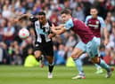BURNLEY, ENGLAND - MAY 22: Callum Wilson of Newcastle United battles for possession with James Tarkowski of Burnley during the Premier League match between Burnley and Newcastle United at Turf Moor on May 22, 2022 in Burnley, England. (Photo by Gareth Copley/Getty Images)