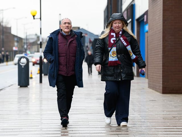 Burnley fans arrive at Turf Moor for the Premier League fixture against West Ham United. Photo: Kelvin Lister-Stuttard