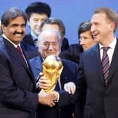 FIFA President Joseph Blatter is flanked by Russian Deputy Prime Minister Igor Shuvalov (right) and Sheikh Hamad bin Khalifa Al-Thani, Emir of Qatar, after the announcement that Russia host the 2018 World Cup and Qatar the 2022 World Cup back in 2010 (credit AP Photo/Michael Probst)