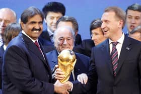 FIFA President Joseph Blatter is flanked by Russian Deputy Prime Minister Igor Shuvalov (right) and Sheikh Hamad bin Khalifa Al-Thani, Emir of Qatar, after the announcement that Russia host the 2018 World Cup and Qatar the 2022 World Cup back in 2010 (credit AP Photo/Michael Probst)