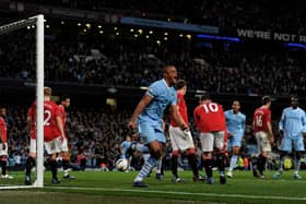 MANCHESTER, ENGLAND - APRIL 30:  Vincent Kompany of Manchester City celebrates scoring the opening goal during the Barclays Premier League match between Manchester City and Manchester United at the Etihad Stadium on April 30, 2012 in Manchester, England.  (Photo by Michael Regan/Getty Images)