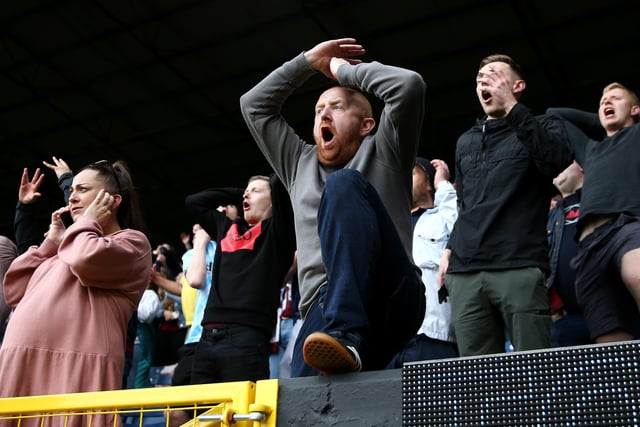BURNLEY, ENGLAND - MAY 22: Burnley fans react during the Premier League match between Burnley and Newcastle United at Turf Moor on May 22, 2022 in Burnley, England. (Photo by Jan Kruger/Getty Images)