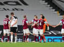 LONDON, ENGLAND - MAY 10: Joachim Andersen (L) of Fulham looks dejected after defeat as Fulham are relegated following the Premier League match between Fulham and Burnley at Craven Cottage on May 10, 2021 in London, England. Sporting stadiums around the UK remain under strict restrictions due to the Coronavirus Pandemic as Government social distancing laws prohibit fans inside venues resulting in games being played behind closed doors. (Photo by Catherine Ivill/Getty Images)