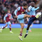 BURNLEY, ENGLAND - MARCH 16: Lorenz Assignon of Burnley battles for possession with Yoane Wissa of Brentford during the Premier League match between Burnley FC and Brentford FC at Turf Moor on March 16, 2024 in Burnley, England. (Photo by Matt McNulty/Getty Images)