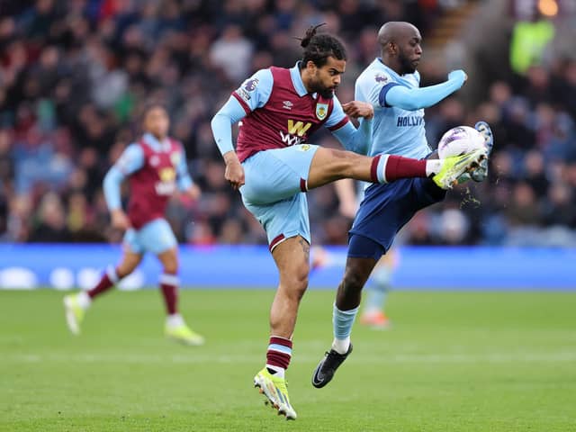 BURNLEY, ENGLAND - MARCH 16: Lorenz Assignon of Burnley battles for possession with Yoane Wissa of Brentford during the Premier League match between Burnley FC and Brentford FC at Turf Moor on March 16, 2024 in Burnley, England. (Photo by Matt McNulty/Getty Images)