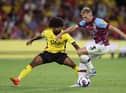 WATFORD, ENGLAND - AUGUST 12: Hamza Choudhury of Watford challenges Charlie Taylor of Burnley during the Sky Bet Championship between Watford and Burnley at Vicarage Road on August 12, 2022 in Watford, England. (Photo by Richard Heathcote/Getty Images)