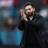 BURNLEY, ENGLAND - JANUARY 08: Carlos Corberan, Manager of Huddersfield Town applauds the fans after their sides victory during the Emirates FA Cup Third Round match between Burnley and Huddersfield Town at Turf Moor on January 08, 2022 in Burnley, England. (Photo by Jan Kruger/Getty Images)