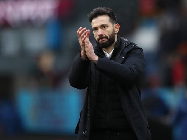 BURNLEY, ENGLAND - JANUARY 08: Carlos Corberan, Manager of Huddersfield Town applauds the fans after their sides victory during the Emirates FA Cup Third Round match between Burnley and Huddersfield Town at Turf Moor on January 08, 2022 in Burnley, England. (Photo by Jan Kruger/Getty Images)