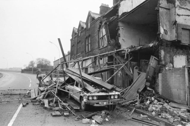 Westgate, Burnley. February 5, 1980

Two demolition men had a miraculous escape on Sunday when they plunged 27 feet from falling brickwork and scaffolding at Westgate. John England, 34, and Steven Burrows, 20, were working on empty property when one of the buildings collapsed, almost burying their pick-up van and blocking the road. John, still shaken, said that the building had started to vibrate as an unloaded juggernaut transporter thundered past, everything began to shake and then the whole lot came down and they just jumped. He walked away with just a grazed write, and Steven with a ripped jumper. They had been taking the building down by hand because of shaky foundations. The work was being carried out by Burnley Building and Construction for North West Estates. Mr. Brian Combe a Director of the company said the scaffolding probably save the men s lives. The building was over 100 years old and not built to stand the heavy traffic now on Westgate. Yesterday, workmen were taking down the rest of the building. Mr. Guy Gardener, deputy Borough surveyor, said building inspectors had closed part of the road until the site was safe. The building which collapsed, 27 and 29 Westgate, had a compulsory purchase order on it and the Council had told the owners to pull it down as it was unsafe.