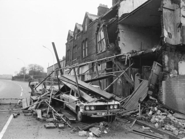 Westgate, Burnley. February 5, 1980
Two demolition men had a miraculous escape on Sunday when they plunged 27 feet from falling brickwork and scaffolding at Westgate. John England, 34, and Steven Burrows, 20, were working on empty property when one of the buildings collapsed, almost burying their pick-up van and blocking the road. John, still shaken, said that the building had started to vibrate as an unloaded juggernaut transporter thundered past, everything began to shake and then the whole lot came down and they just jumped. He walked away with just a grazed write, and Steven with a ripped jumper. They had been taking the building down by hand because of shaky foundations. The work was being carried out by Burnley Building and Construction for North West Estates. Mr. Brian Combe a Director of the company said the scaffolding probably save the men s lives. The building was over 100 years old and not built to stand the heavy traffic now on Westgate. Yesterday, workmen were taking down the rest of the building. Mr. Guy Gardener, deputy Borough surveyor, said building inspectors had closed part of the road until the site was safe. The building which collapsed, 27 and 29 Westgate, had a compulsory purchase order on it and the Council had told the owners to pull it down as it was unsafe.