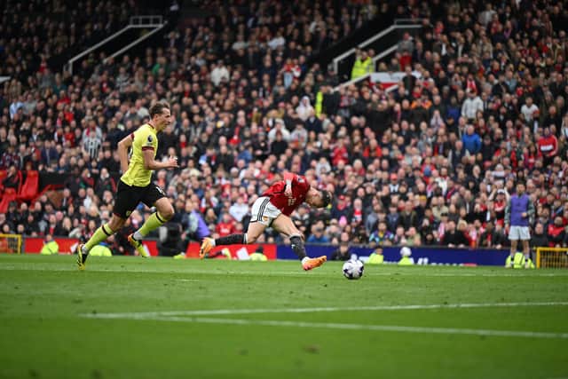 MANCHESTER, ENGLAND - APRIL 27: Antony of Manchester United scores his team's first goal during the Premier League match between Manchester United and Burnley FC at Old Trafford on April 27, 2024 in Manchester, England. (Photo by Michael Regan/Getty Images)