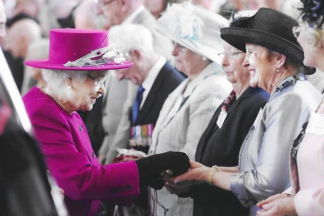 This is one of the photos that will be on display at the Padiham Archives exhibition of organiser Ann Clark receiving Maundy Money from Her Majesty the Queen at Blackburn Cathedral in 2013.