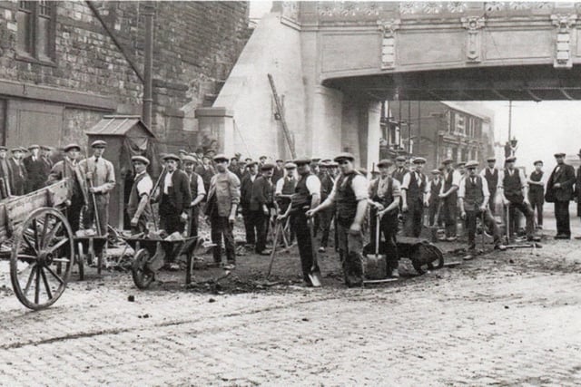 A large gang of workers on Yorkshire Street, just under the Culvert which was completed in 1926.