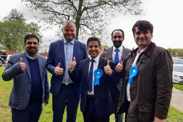 Pendle Council leader Coun. Nadeem Ahmed (third from left) and Pendle MP Andrew Stephenson (second from left) joined celebrations as the Conservatives held control of Pendle Council