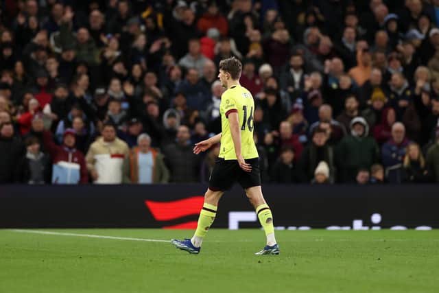 BIRMINGHAM, ENGLAND - DECEMBER 30: Sander Berge of Burnley leaves the field dejected after being shown a red card by Referee Stuart Attwell (not pictured) during the Premier League match between Aston Villa and Burnley FC at Villa Park on December 30, 2023 in Birmingham, England. (Photo by Ryan Pierse/Getty Images)