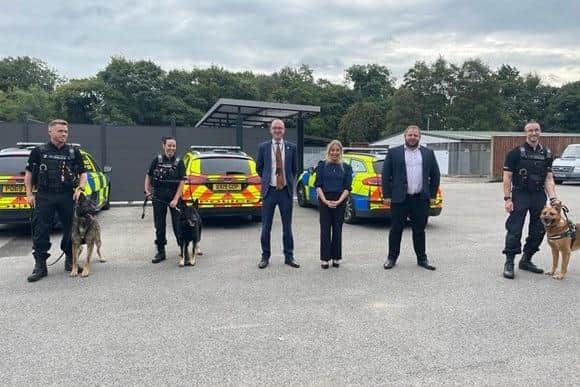 Burnley MP Antony Higginbotham (second from right) with Lancashire's Police and Crime Commissioner Andrew Snowden (third from left) Hyndburn MP Sara Britcliffe and officers from the dog handling division at Lancashire Police HQ