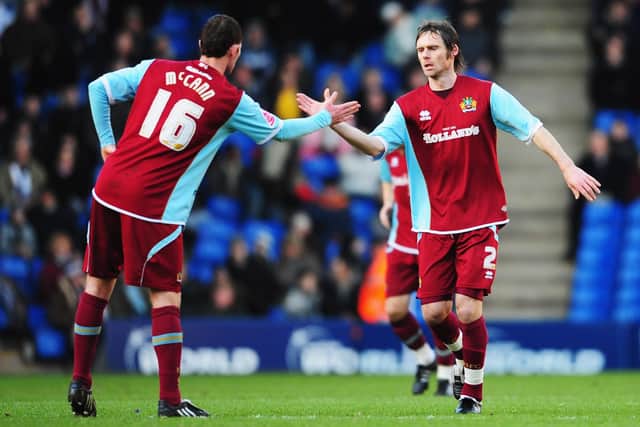 WEST BROMWICH, UNITED KINGDOM - JANUARY 24: Graham Alexander (R) of Burnley is congratulated by team mate Chris McCann (L) after scoring from the penalty spot during the FA Cup sponsored by E.ON 4th Round match between West Bromwich Albion and Burnley at The Hawthorns on January 24, 2009 in London, England.  (Photo by Clive Mason/Getty Images)
