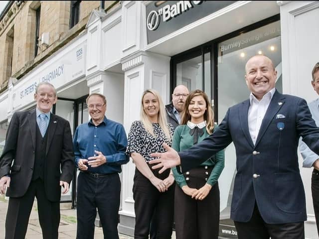 Dave Fishwick and staff outside Burnley Savings and Loans bank