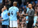 MANCHESTER, ENGLAND - OCTOBER 20:  Josep Guardiola, Manager of Manchester City speaks with Vincent Kompany of Manchester City during the Premier League match between Manchester City and Burnley FC at Etihad Stadium on October 20, 2018 in Manchester, United Kingdom.  (Photo by Shaun Botterill/Getty Images)