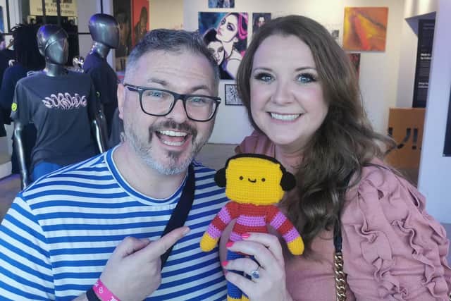 Colne illustrator Jay Stansfield with his character Colin of The Squibbles at his art exhibition in Miami.