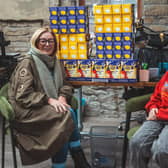 George Greenwood, pictured with Nicola Heys of Reliable Renewables in Barrowford, who made a generous donation to his appeal for Easter eggs to give to children spending the break in hospital