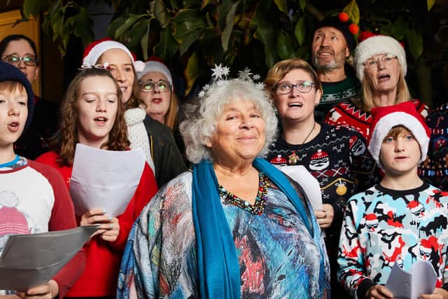 Miriam Margolyes in South West London with a group of Christmas carollers ahead of Channel 4's Miriam's Dickensian Christmas