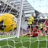 LIVERPOOL, ENGLAND - FEBRUARY 10: Luis Diaz of Liverpool (2L) scores his team's second goal during the Premier League match between Liverpool FC and Burnley FC at Anfield on February 10, 2024 in Liverpool, England. (Photo by Justin Setterfield/Getty Images)